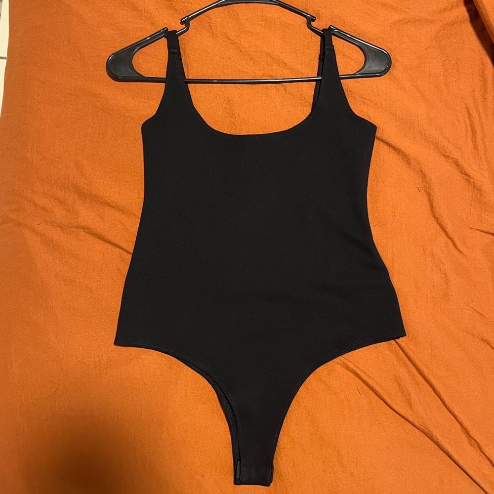 Black Bodysuit size small. Snatching